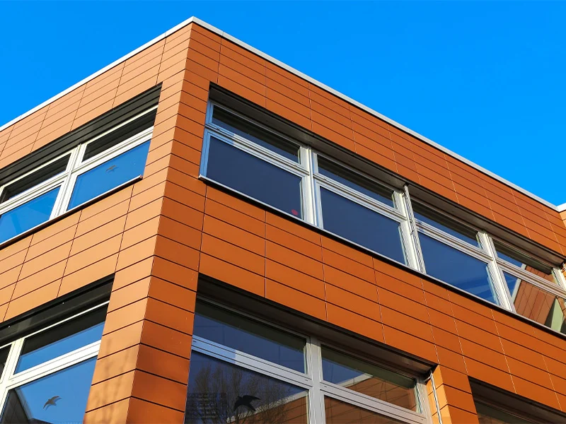 Building facade clad with powder-coated panels.