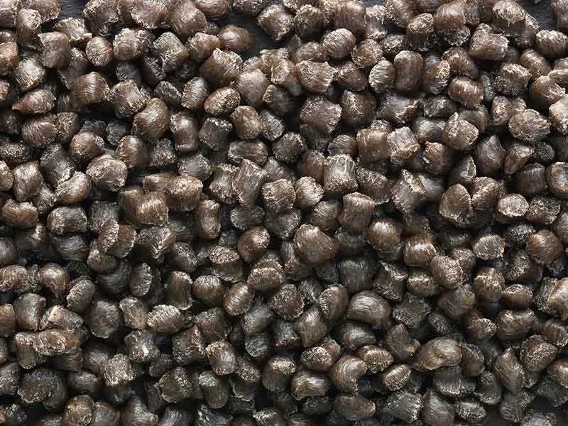 Black granulate from NFC compounds manufactured using BUSS compounding systems.